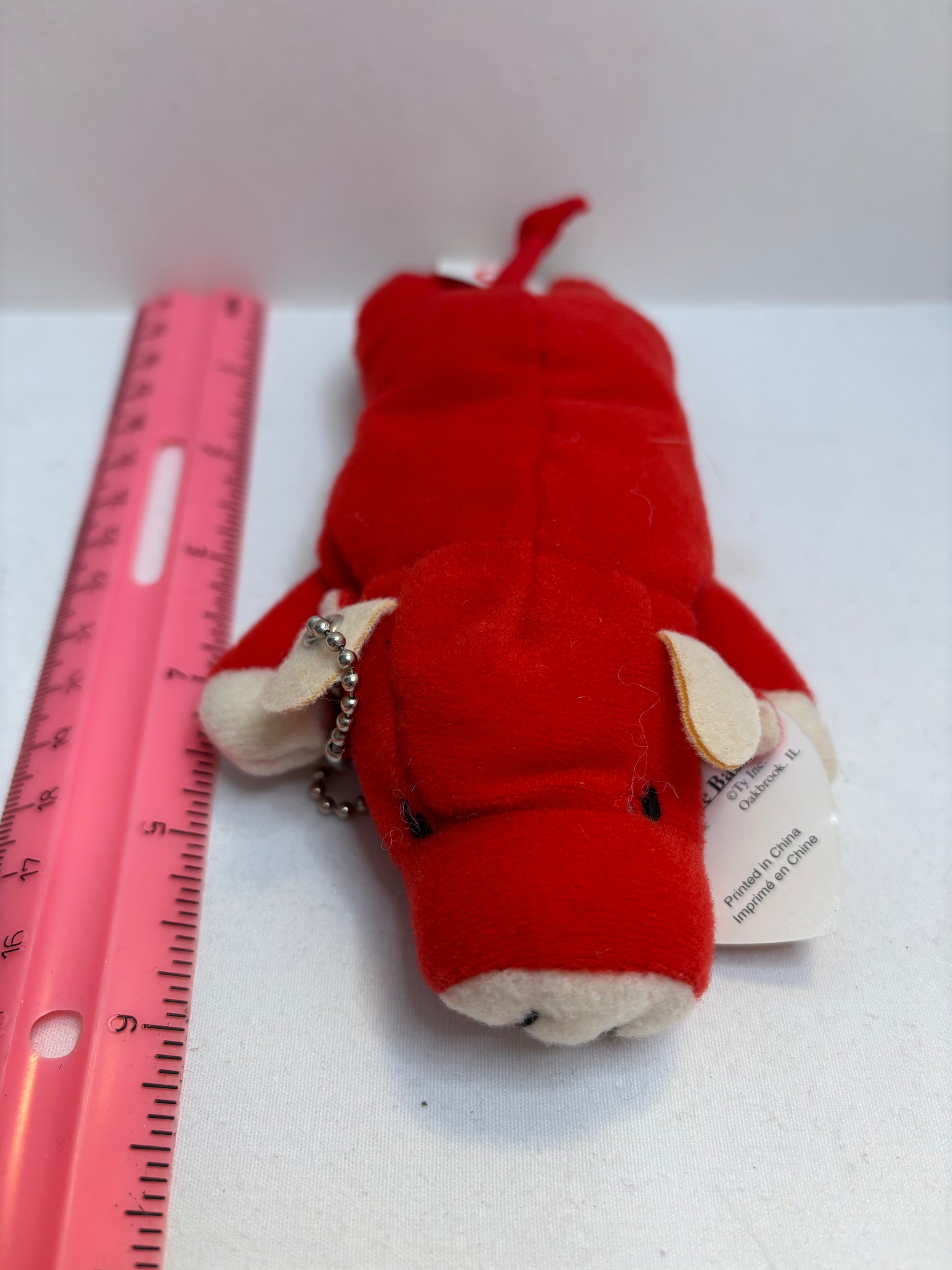 Red bull plush bag charm on a white background