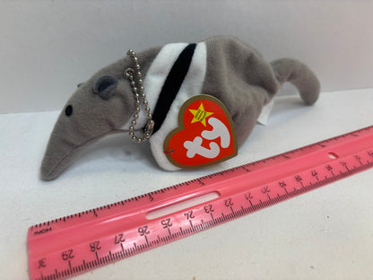 Plush gray anteater bag charm on a white background