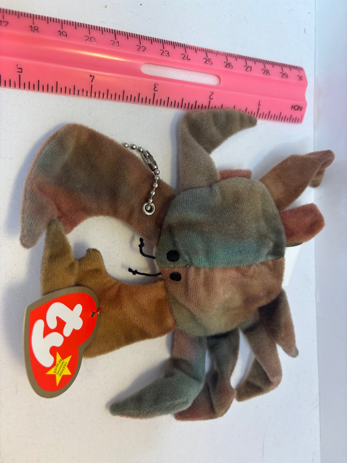 brown and green crab Plush bag charm on a white background