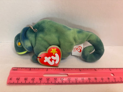 Green iguana plush bag charm on a white background