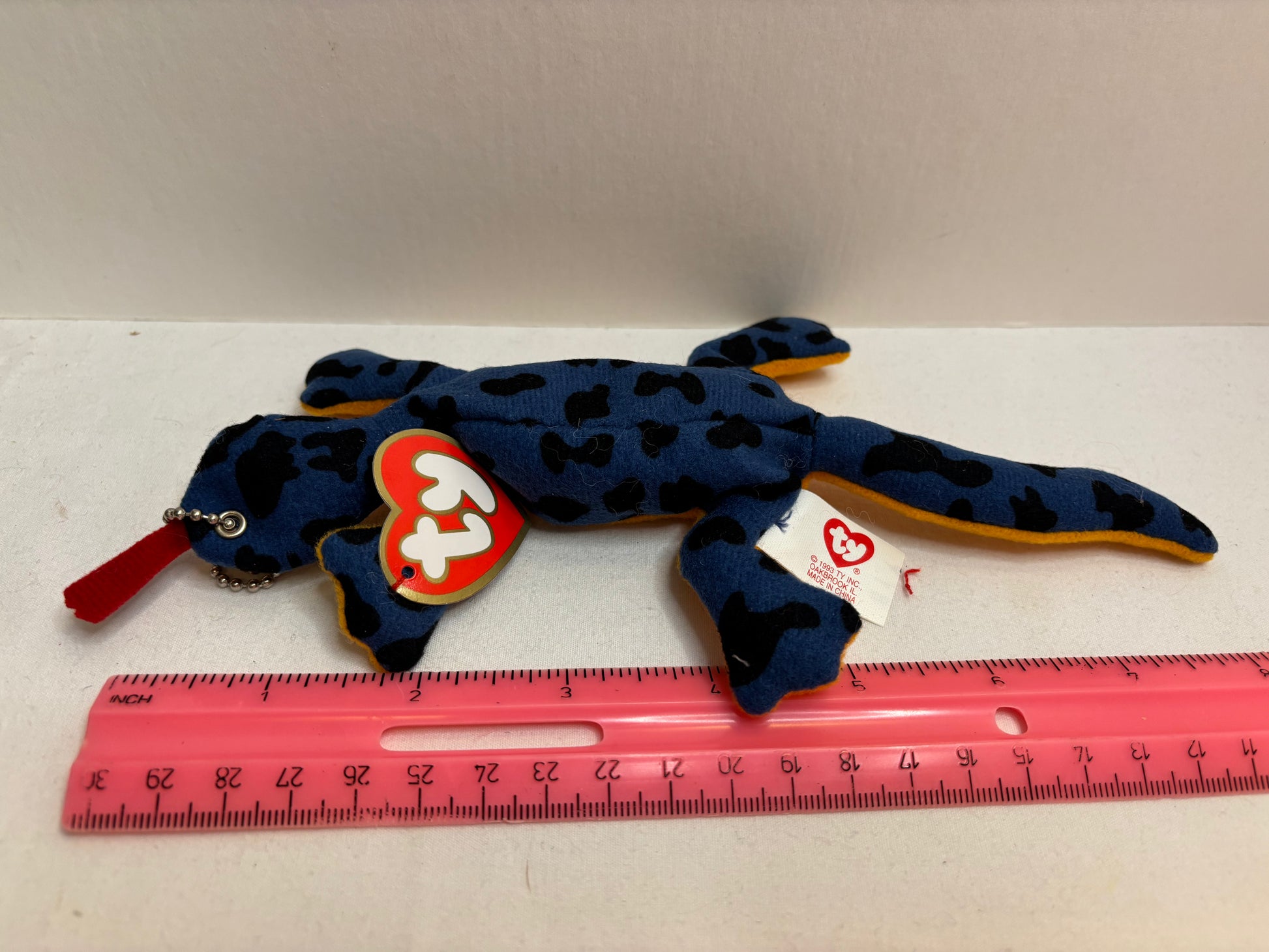 blue lizard with black spots and orange belly plush bag charm