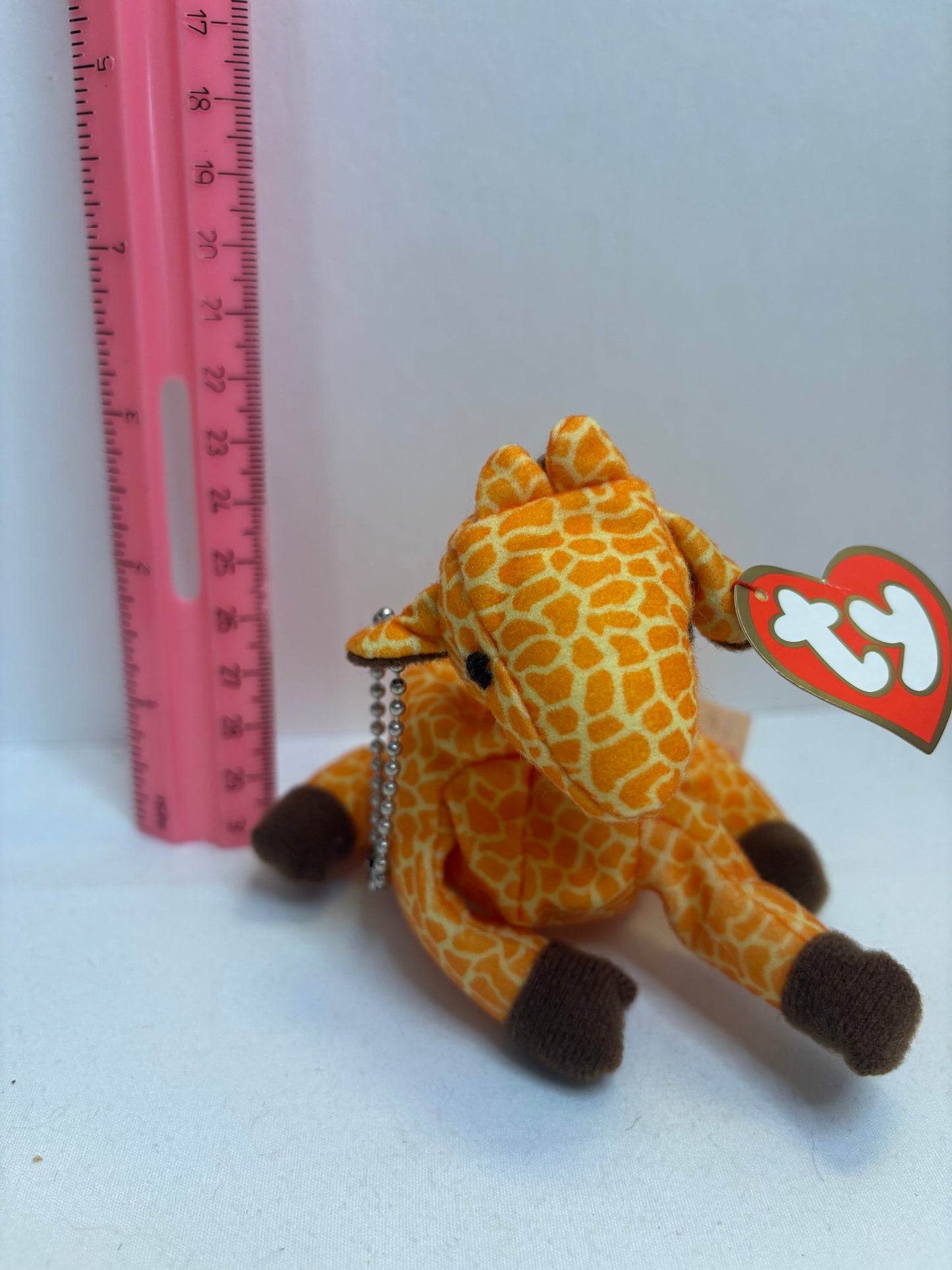 orange and yellow giraffe plush bag charm