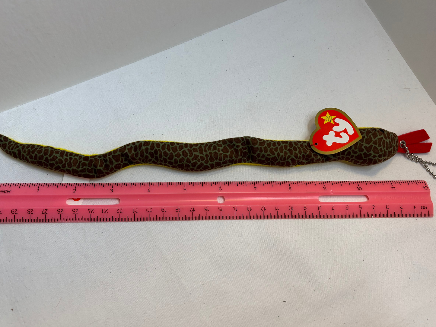 brown and green snake plush bag charm