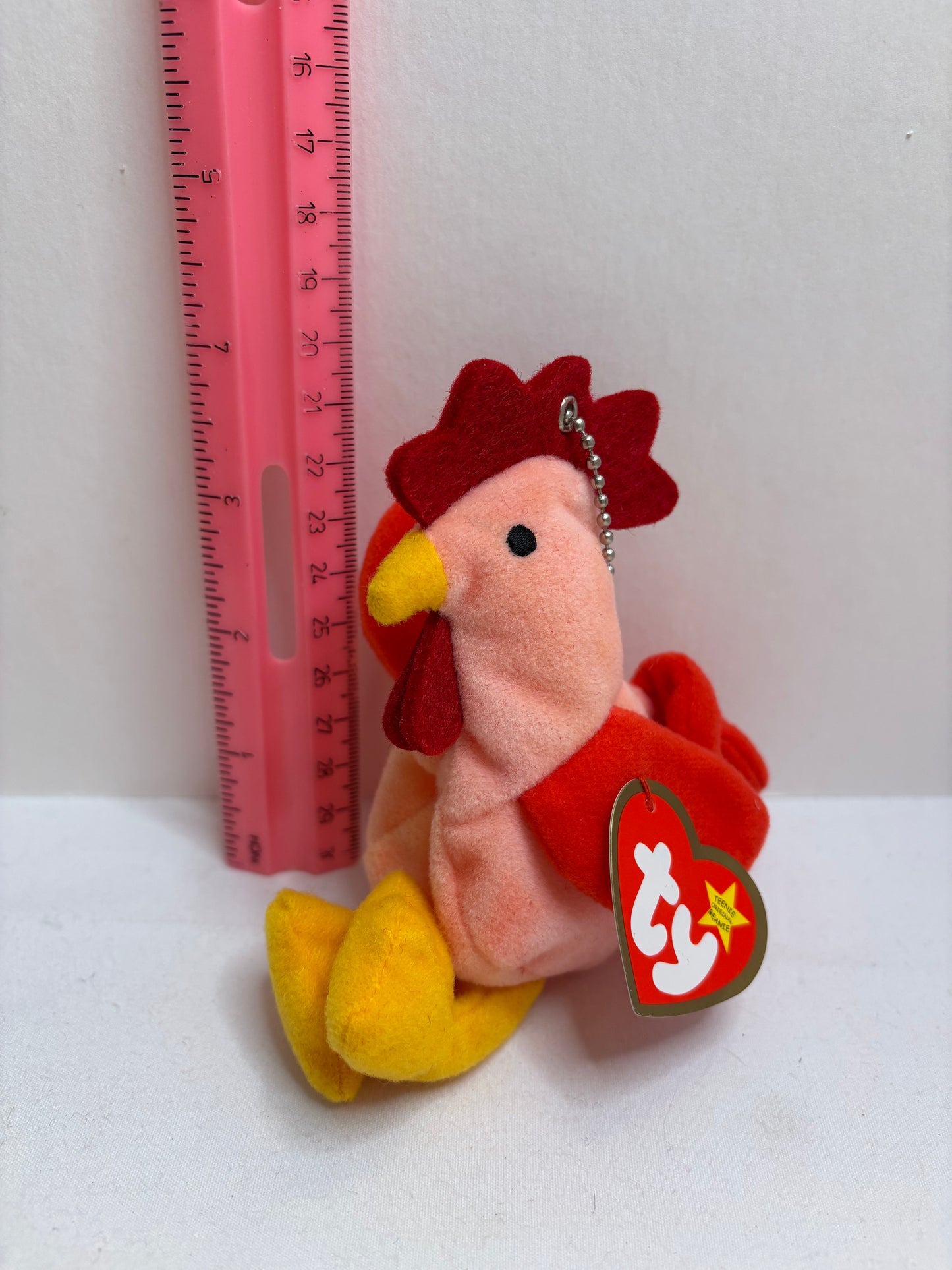 pink and red rooster plush bag charm