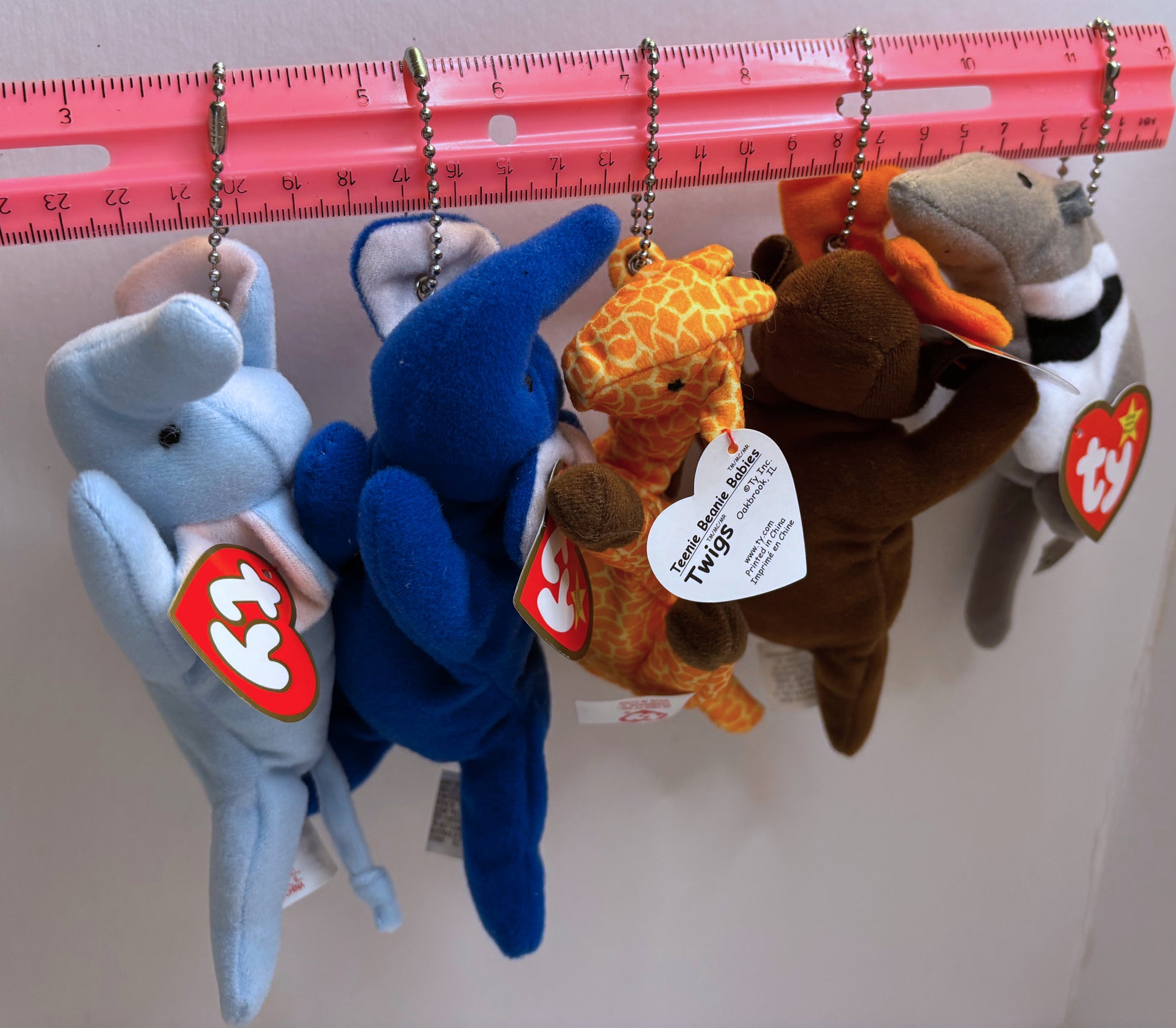 assorted multicolored plush bag charms