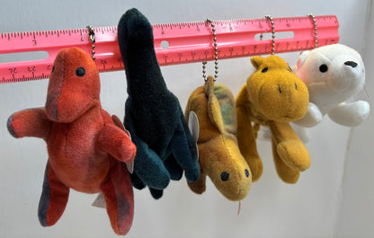 assorted colorful beanie baby plush toy bag charms on a white background