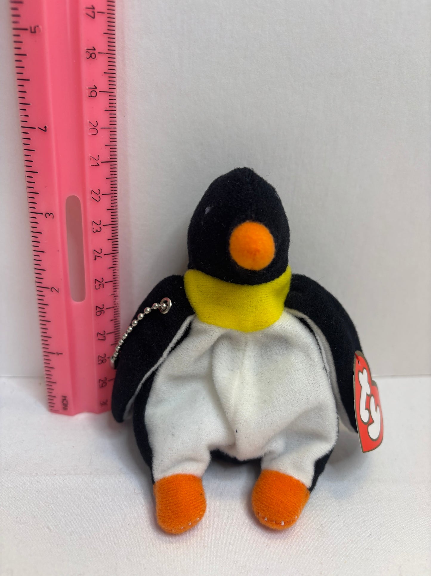 black and white penguin with orange feet and beak plush bag charm