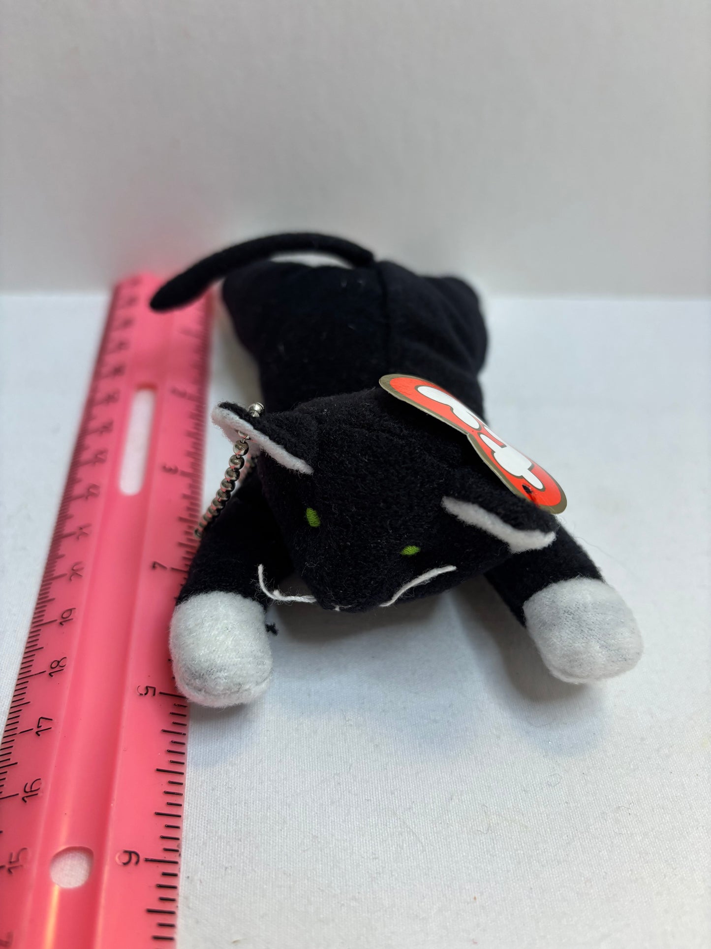black cat with white feet plush bag charm